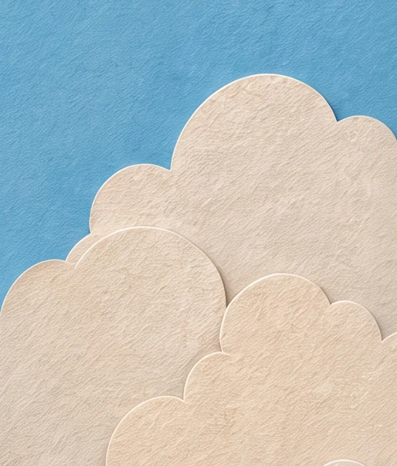 Rounded cream clouds rising at the right of a bright blue sky, beside the queen's sleeve